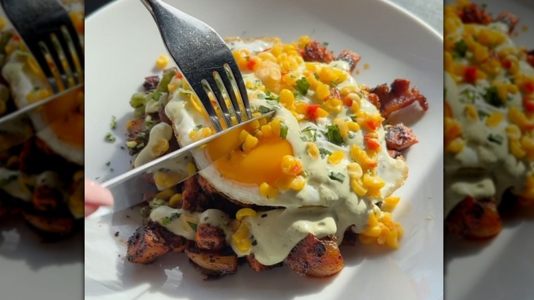 knife cutting sweet potato hash