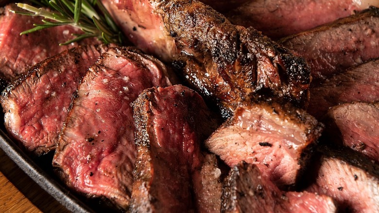 Sliced steak with rosemary