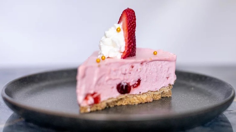 Cheesecake with strawberry garnish