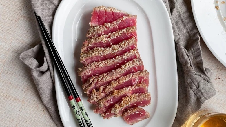 Sliced tuna with chopsticks