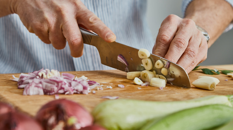 Chopping garlic and onion