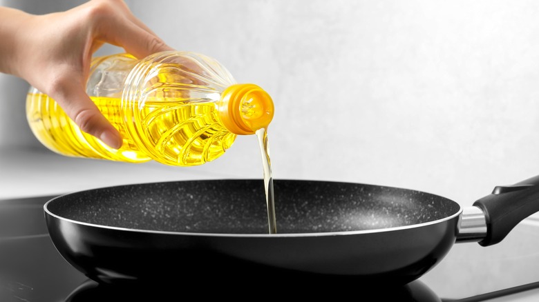 Oil pouring into a pan