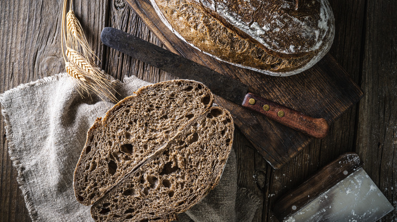 Rustic rye bread on wood 