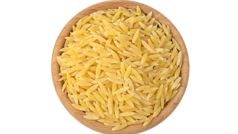 Orzo pasta in a wood bowl