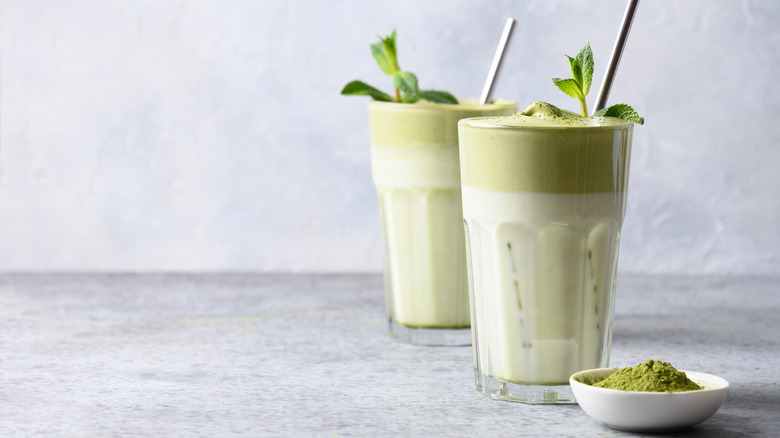 Matcha tea glasses on surface