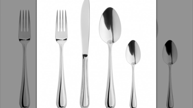 Metal silverware on white background