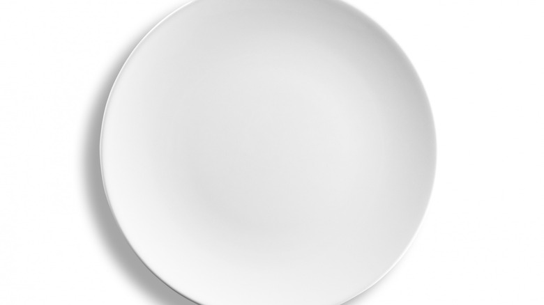 White dinner plate on white background