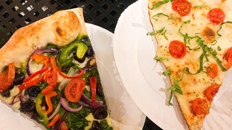 Pizza slices on white plates