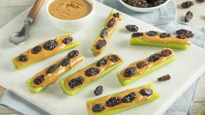 Ants on a log with celery, peanut butter and raisins 