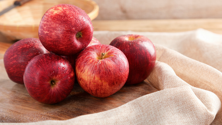 Apples on wooden board