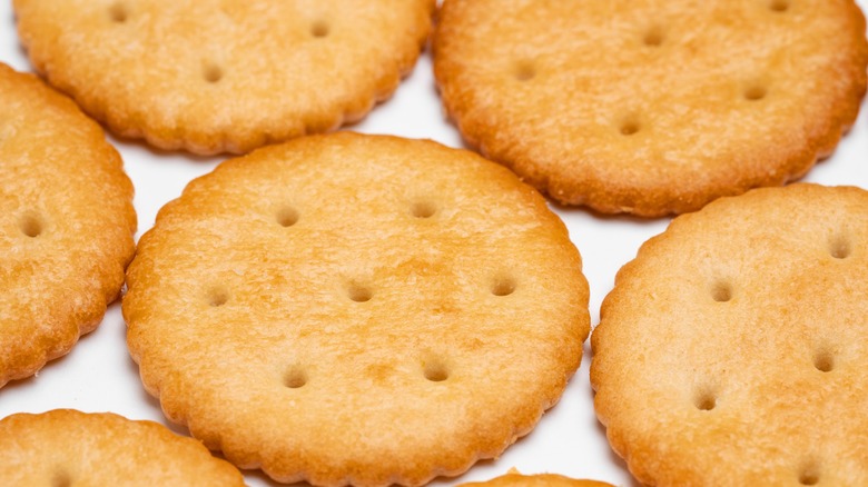 Butter crackers on white table