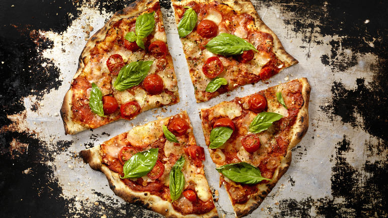 sliced pizza with basil