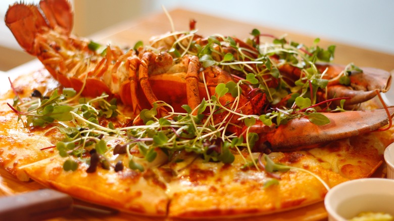 lobster and microgreens on pizza