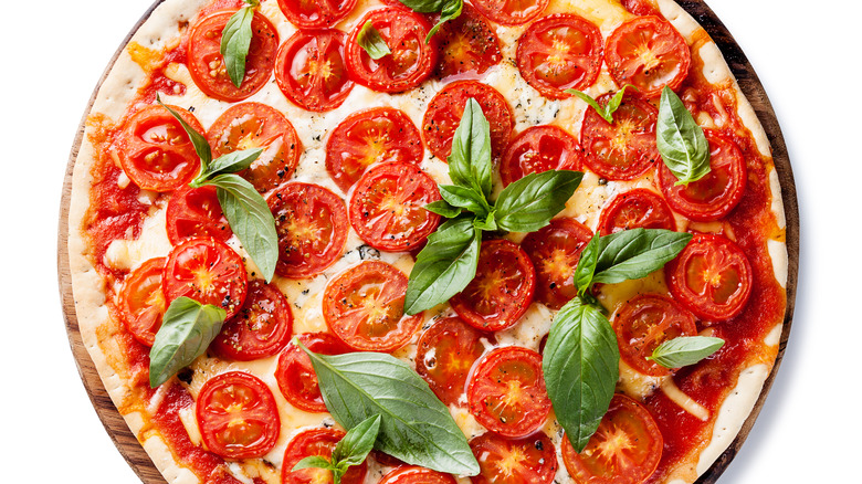 pizza with tomatoes and basil