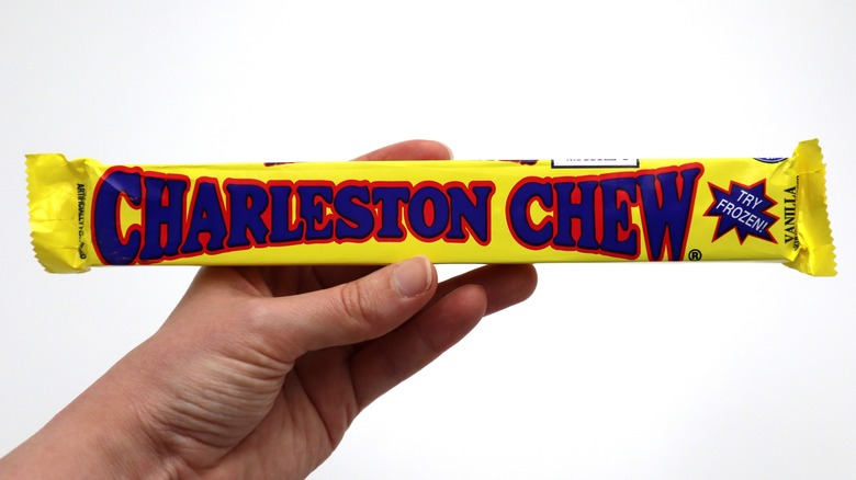 Hand holding a Charleston Chew bar