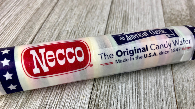 Roll of NECCO wafers on a wooden surface