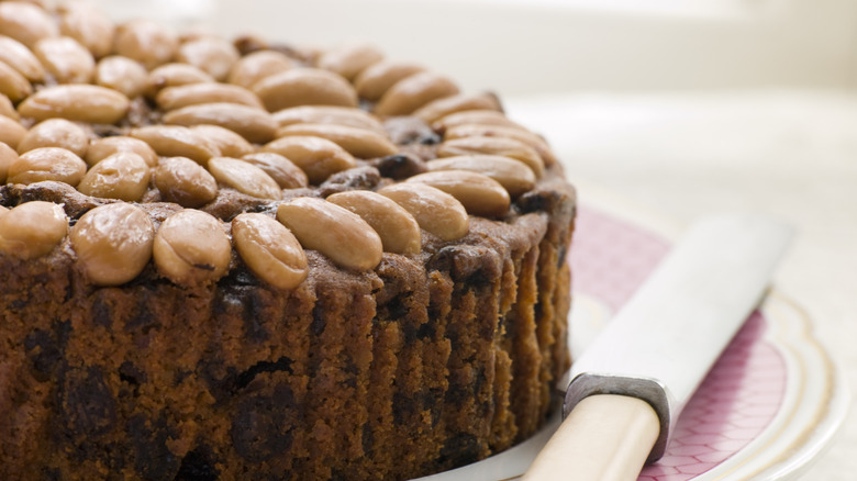 Dundee cake on plate knife