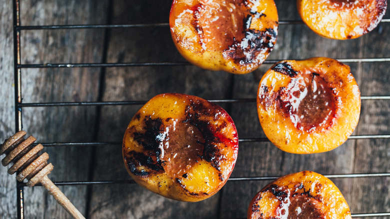 Caramelized peaches on grill