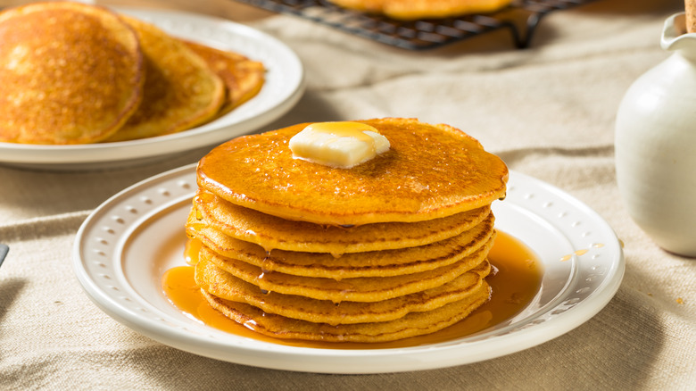 stack of johnnycakes syrup butter