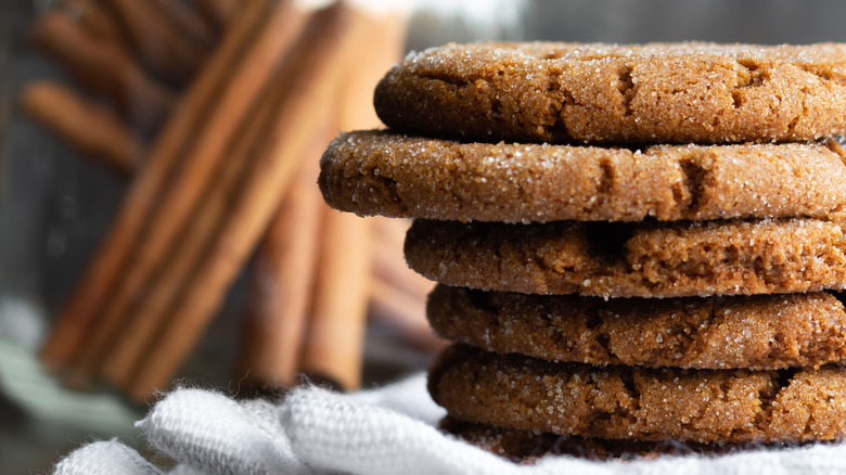 Gingersnap cookies stacked on towel