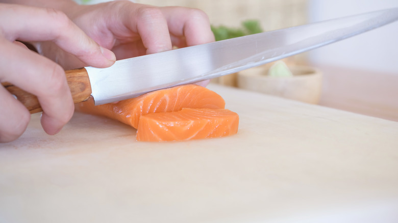 Yanagiba knife cutting sushi