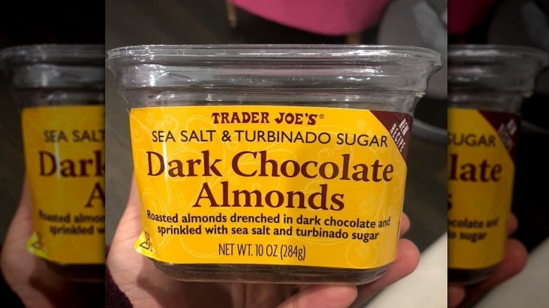 Dark chocolate almonds in container