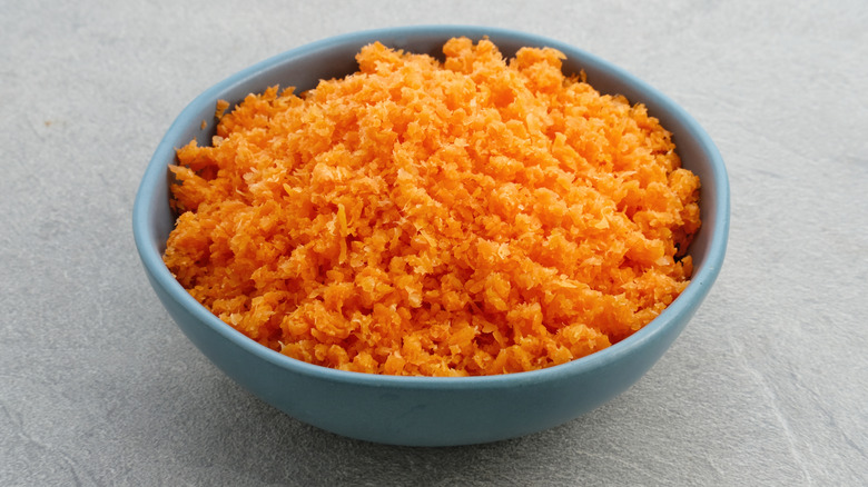 Carrot pulp in blue bowl