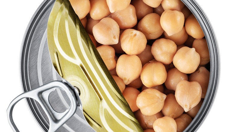 Canned chickpeas on white background