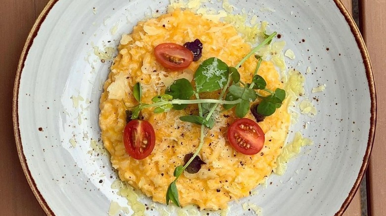 Pumpkin risotto on clay plate