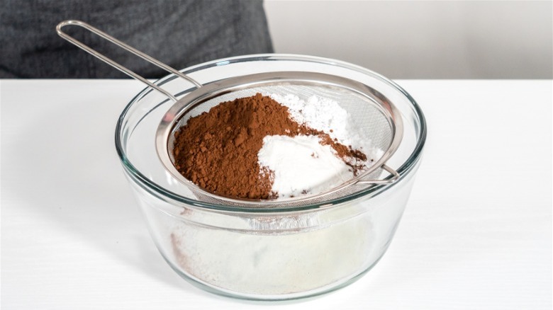 Sifting hot cocoa mix ingredients