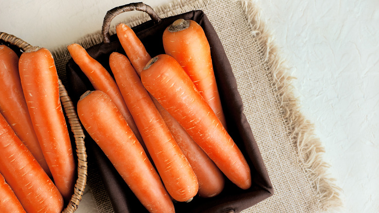 carrots in baksets on cloth