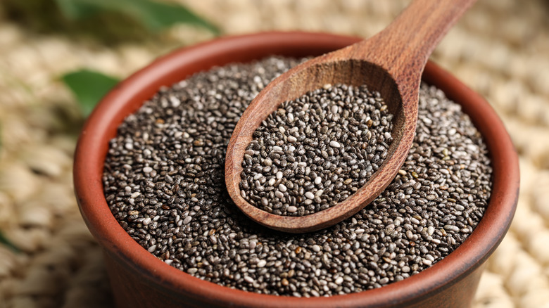 chia seeds in wooden bowl with spoon