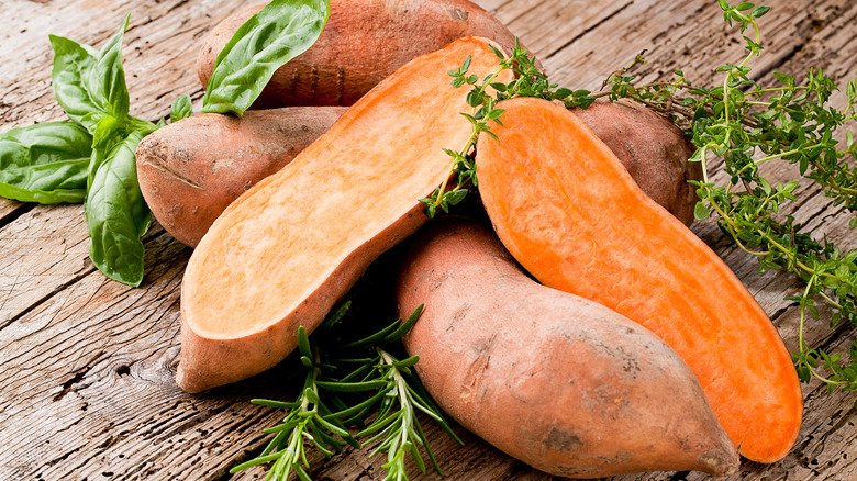 sliced sweet potatoes on wooden surface