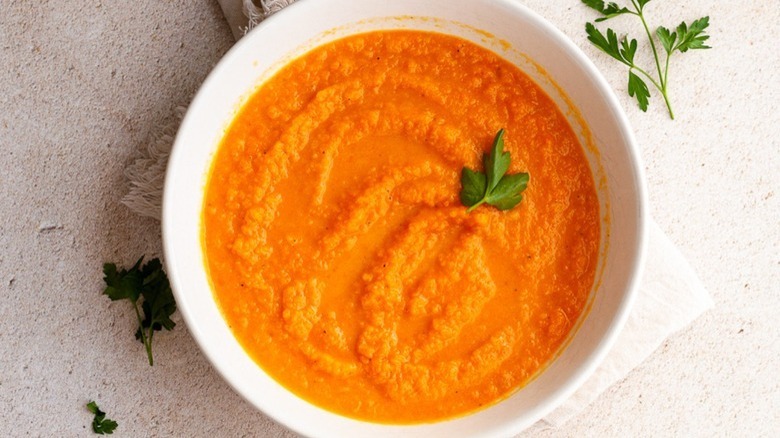 Carrot ginger soup white bowl