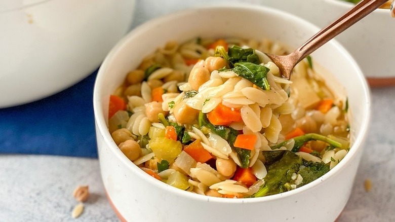 Vegetable orzo soup in bowl