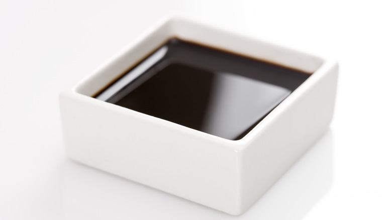 square white bowl with soy sauce