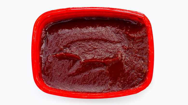Gochujang in its red rectangular tub