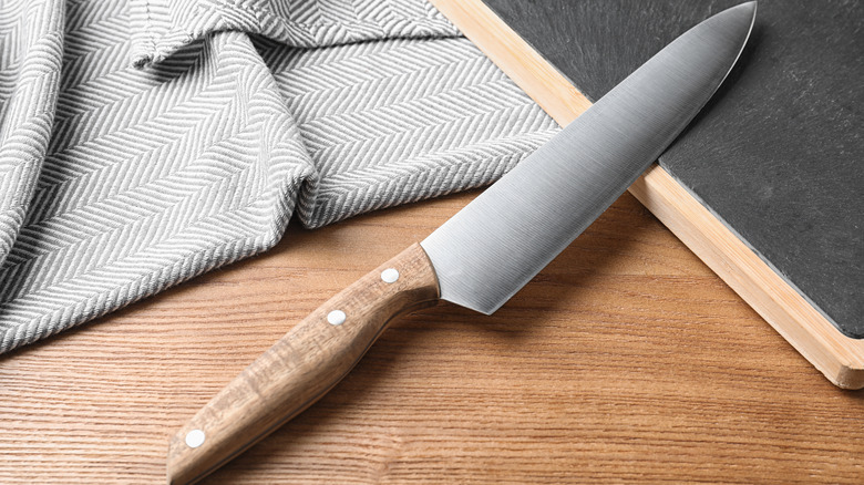 Chef's knife on bamboo board