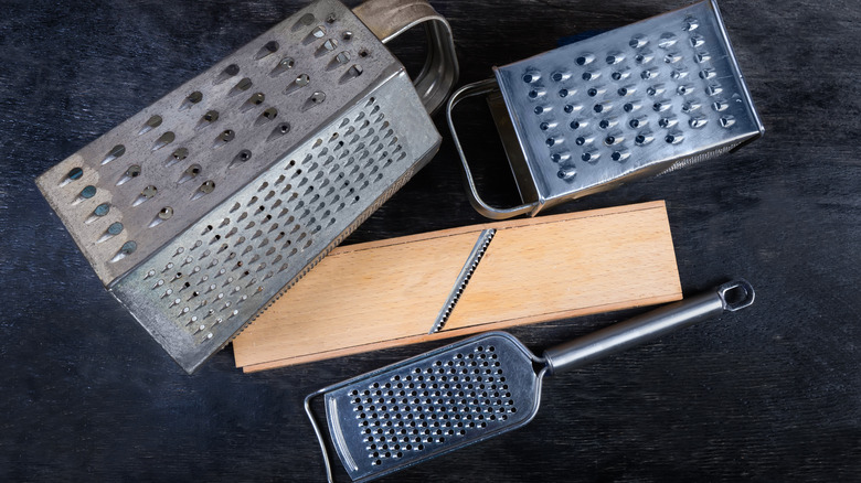 Different graters on black background