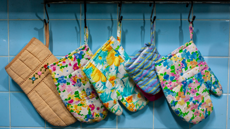 Oven mits hanging on wall