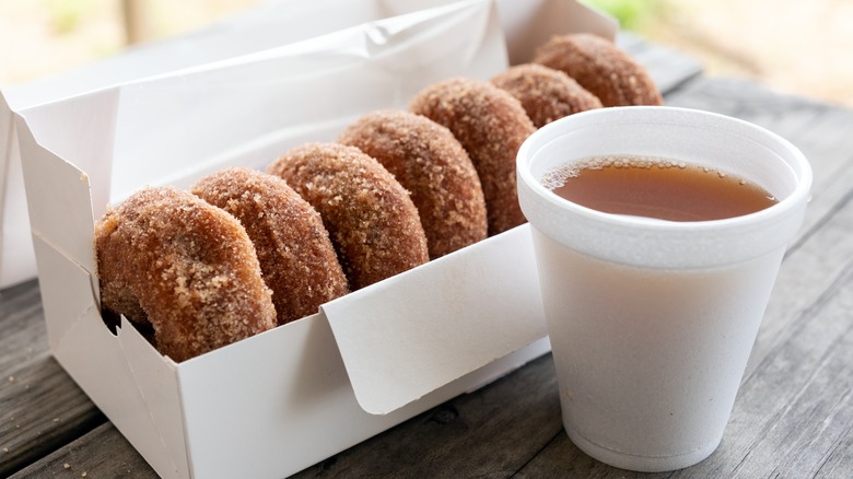 Cider donuts with cup of cider