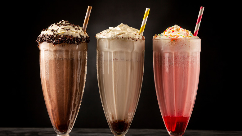 Chocolate, vanilla, and strawberry frappes in a row