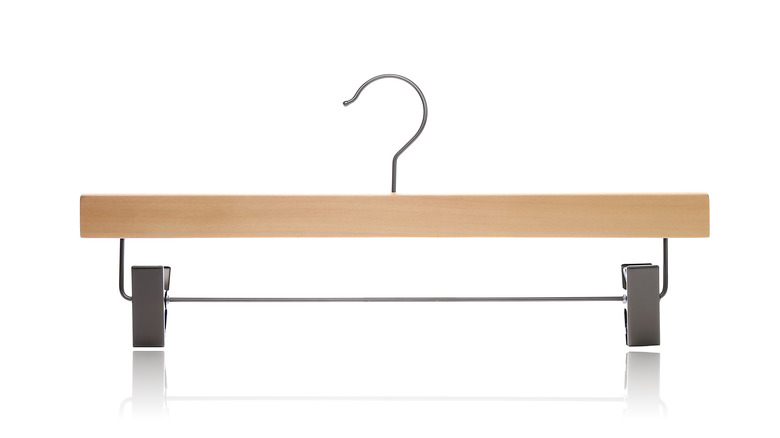 Wooden pants hanger on white