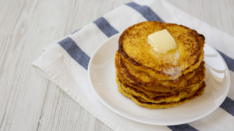 Stacked johnnycakes white plate