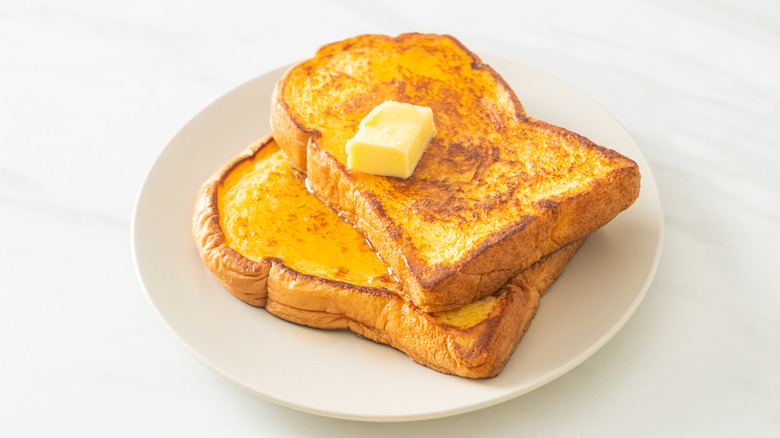 French toast on a plate with butter