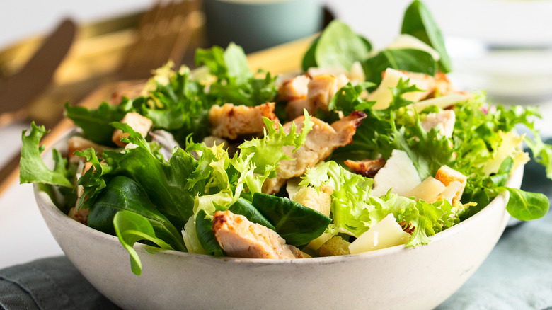 Chicken Caesar salad on table