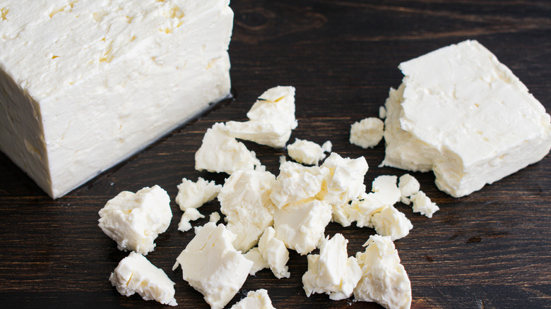 Feta crumbled on wood