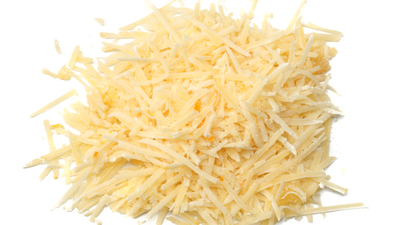 Shredded cheese on white background