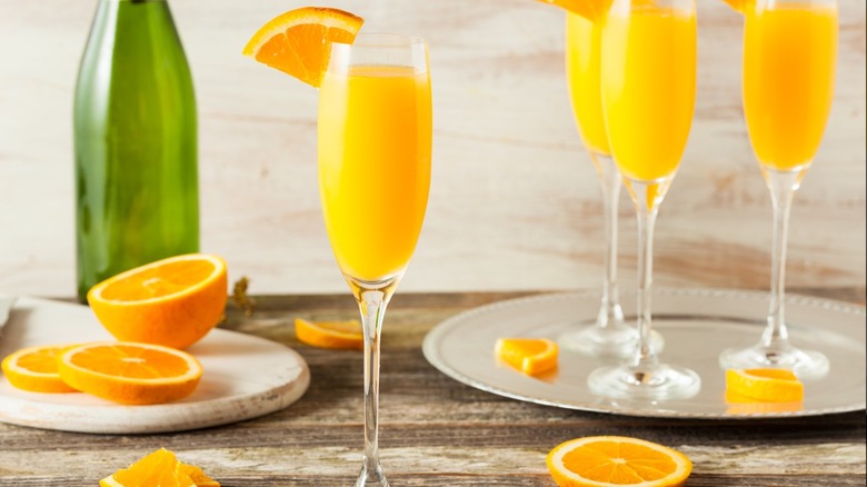 Mimosa cocktails and oranges