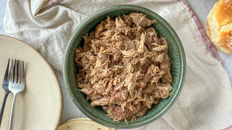 Carnitas in green bowl